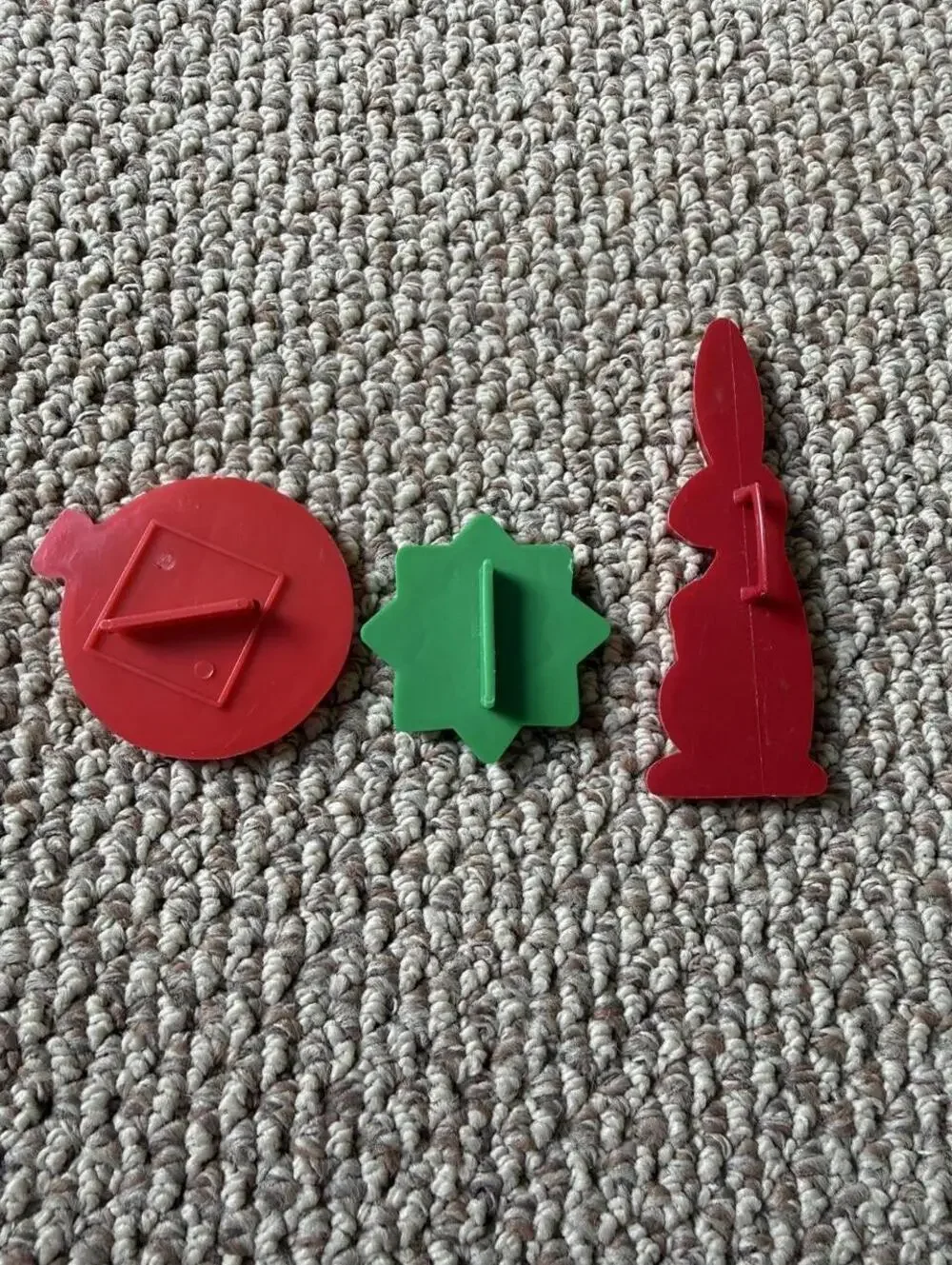 Vintage Christmas cookie cutters with red and green holiday shapes